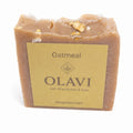 Bar of oatmeal soap with Olavi label on a white background