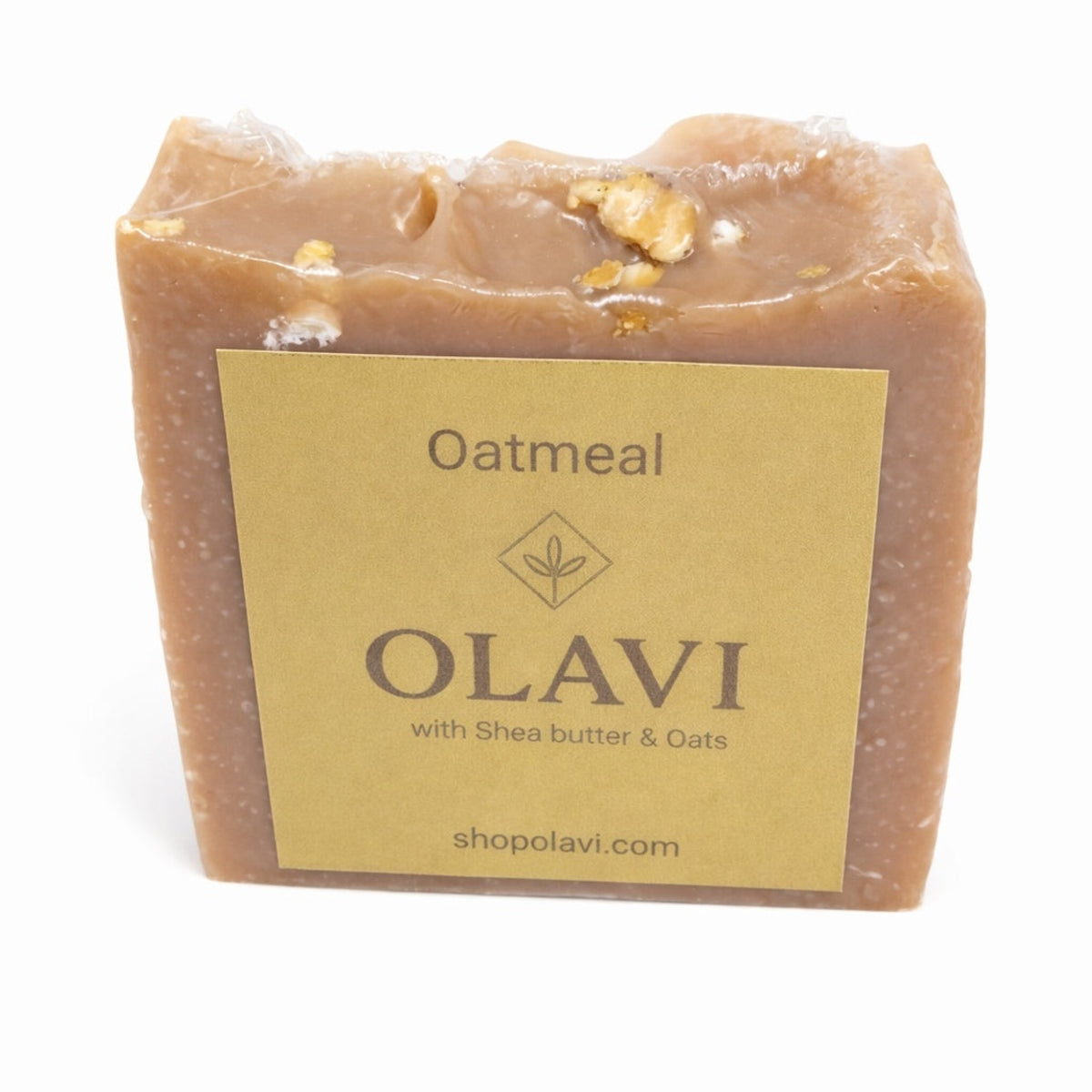 Bar of oatmeal soap with Olavi label on a white background
